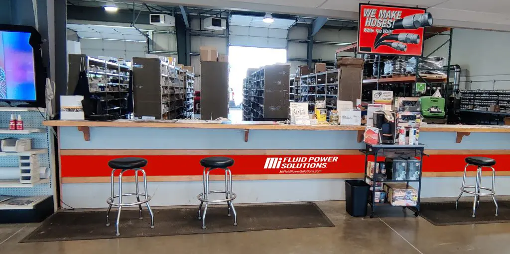 Interior view of Mi Fluid Power Solutions store counter open to back part storage area